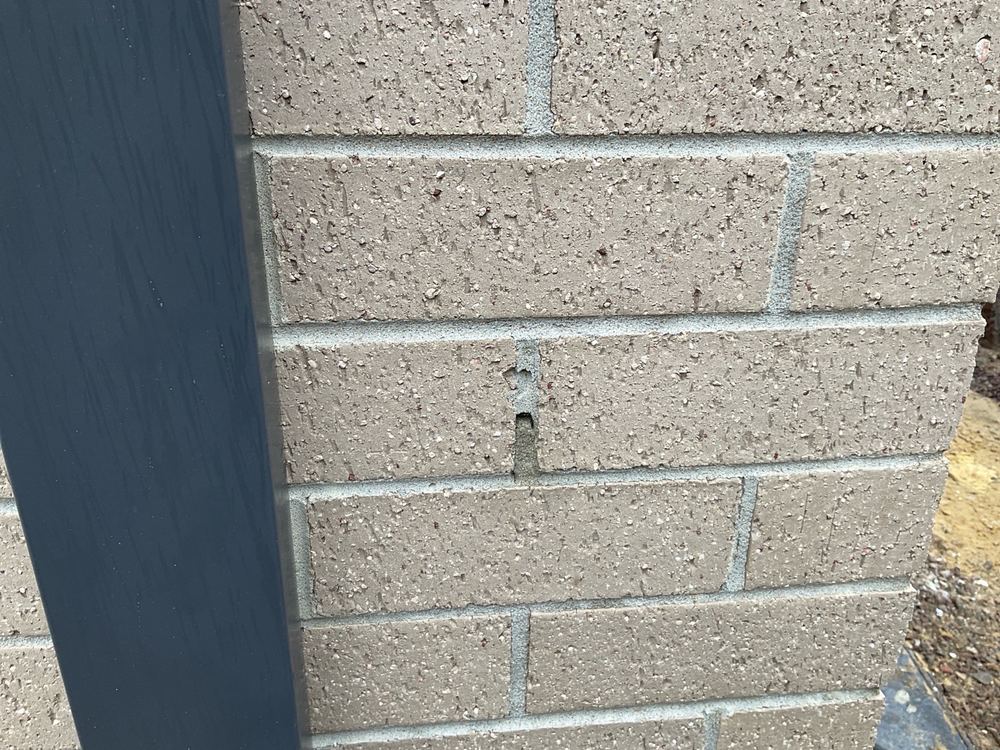 Blown out mortar in face brickwork that needs refilling in a matching colour, Pakenham