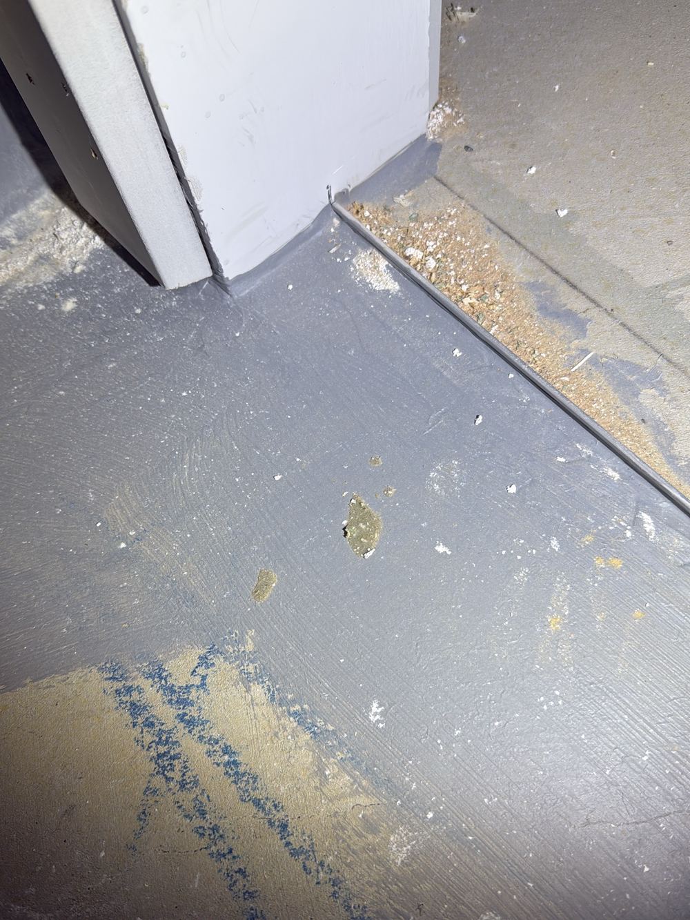 Water stop at the bathroom doorway not built to the current waterproofing standard, found during a fixing inspection in Pakenham