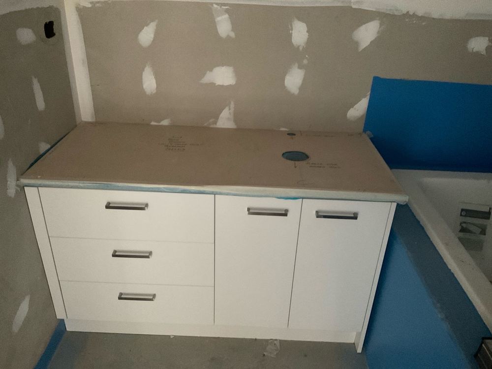 Vanity fitted after waterproofing, hiding the membrane behind it, found during a fixing inspection in Pakenham