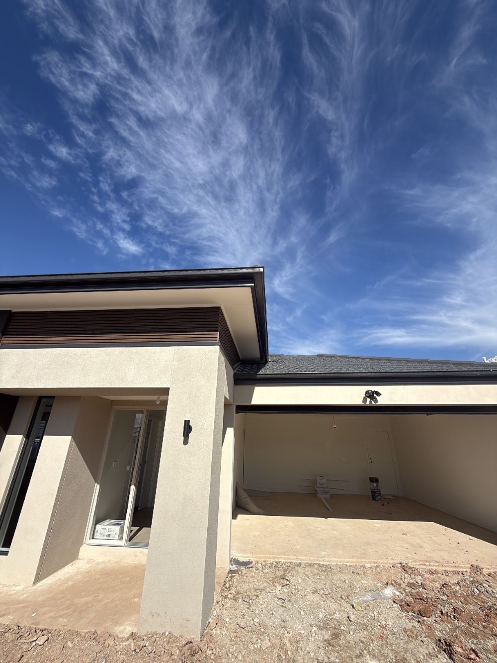 Roofing junction above the porch left open to the roof void, found during a pre-handover inspection in Pakenham