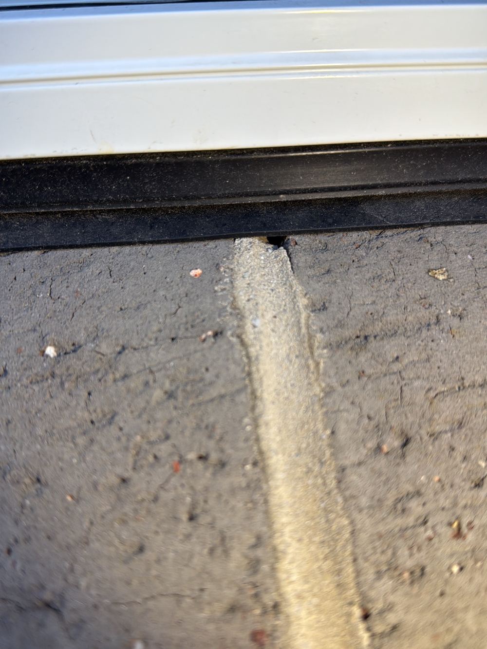 Mortar gaps along a brick window sill, a path for wind driven rain into the cavity, found during a pre-handover inspection in Pakenham