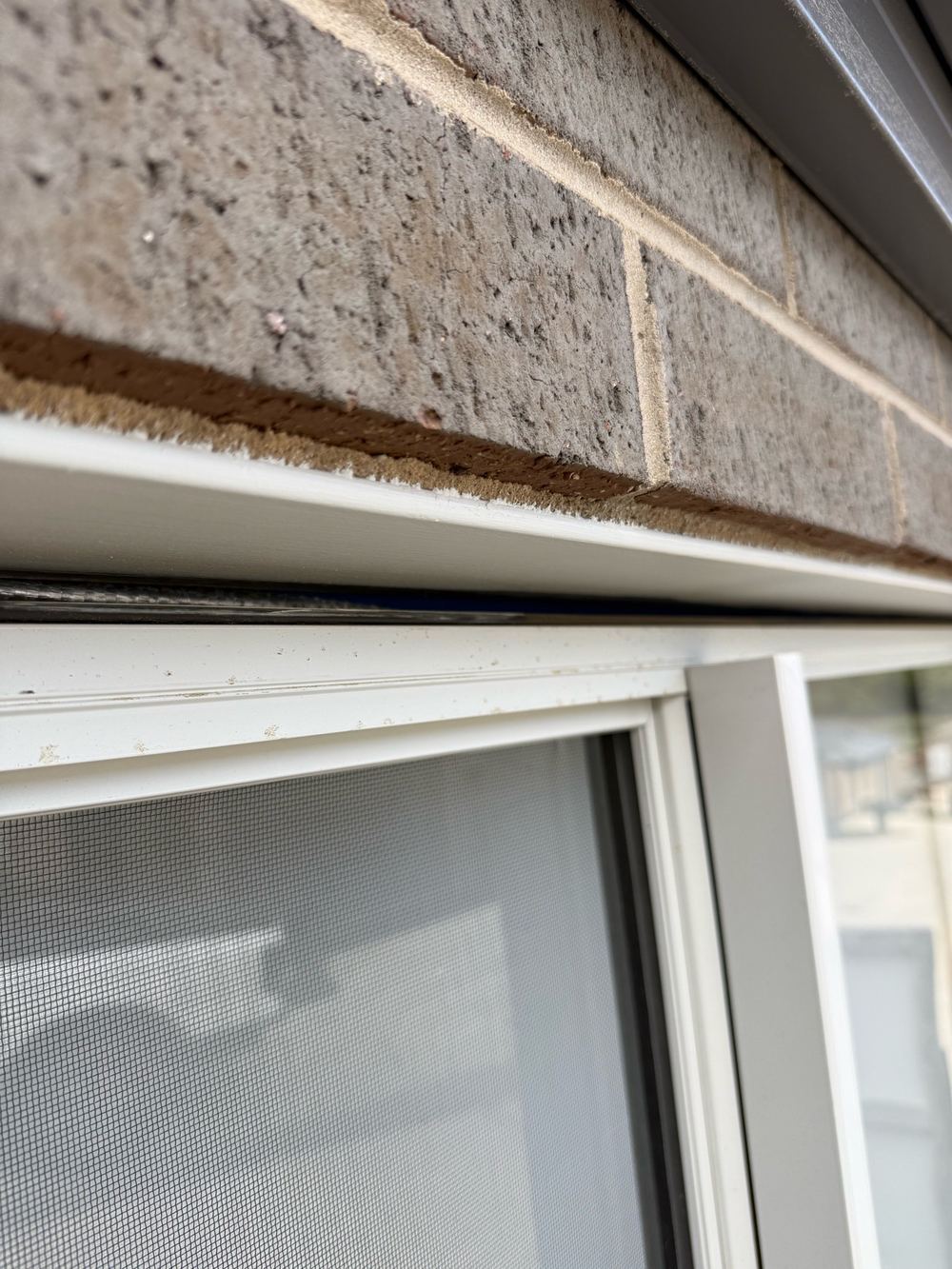 Gap above a window with the timber frame showing, never sealed or flashed, found during a pre-handover inspection in Pakenham