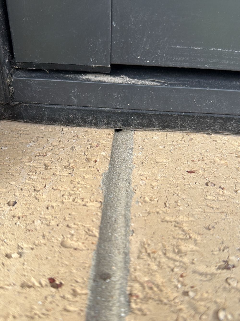 Gap between the window frame and the brick sill below it, Pakenham