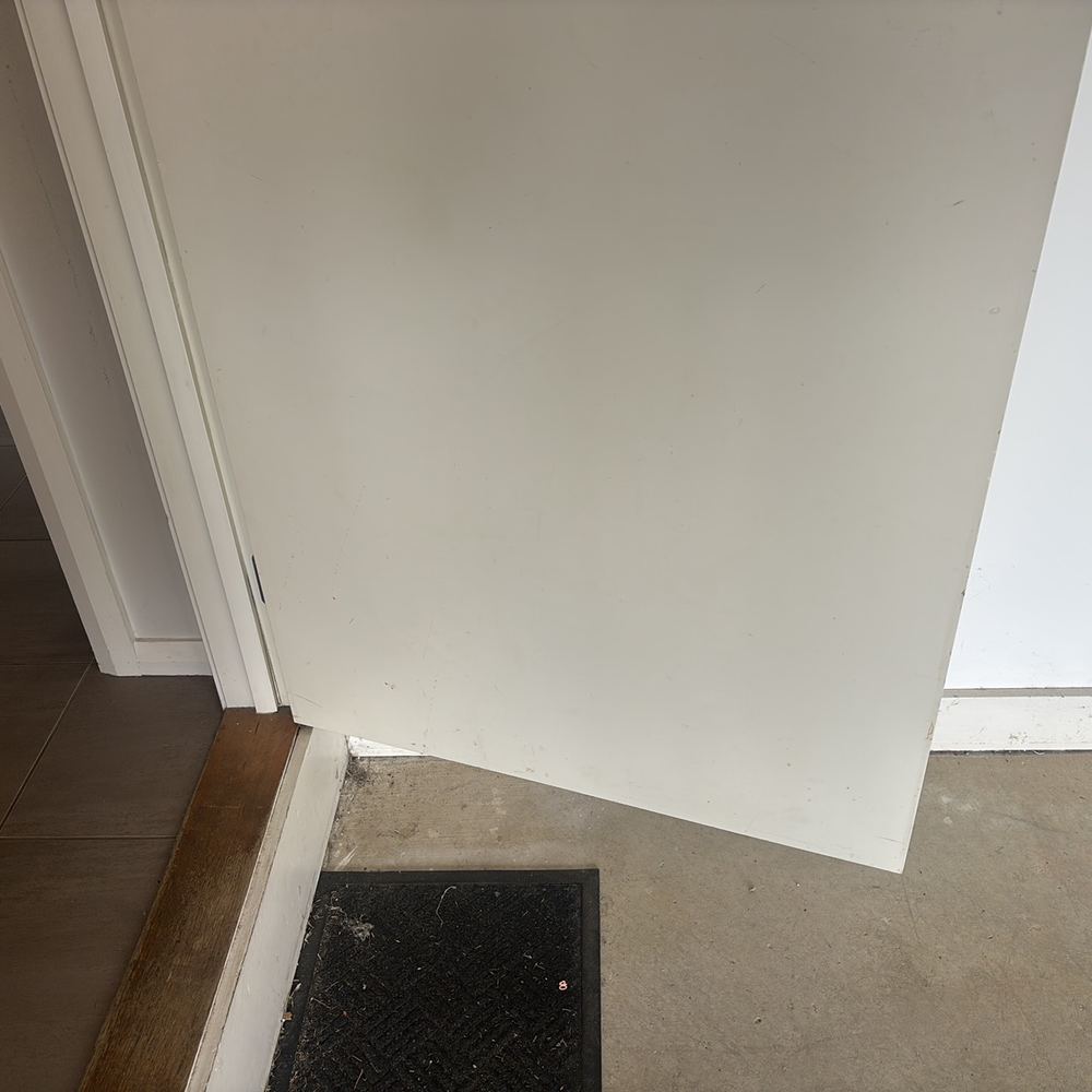 External door with no weather seal, letting drafts and water in underneath, found during a pre-purchase inspection in Pakenham