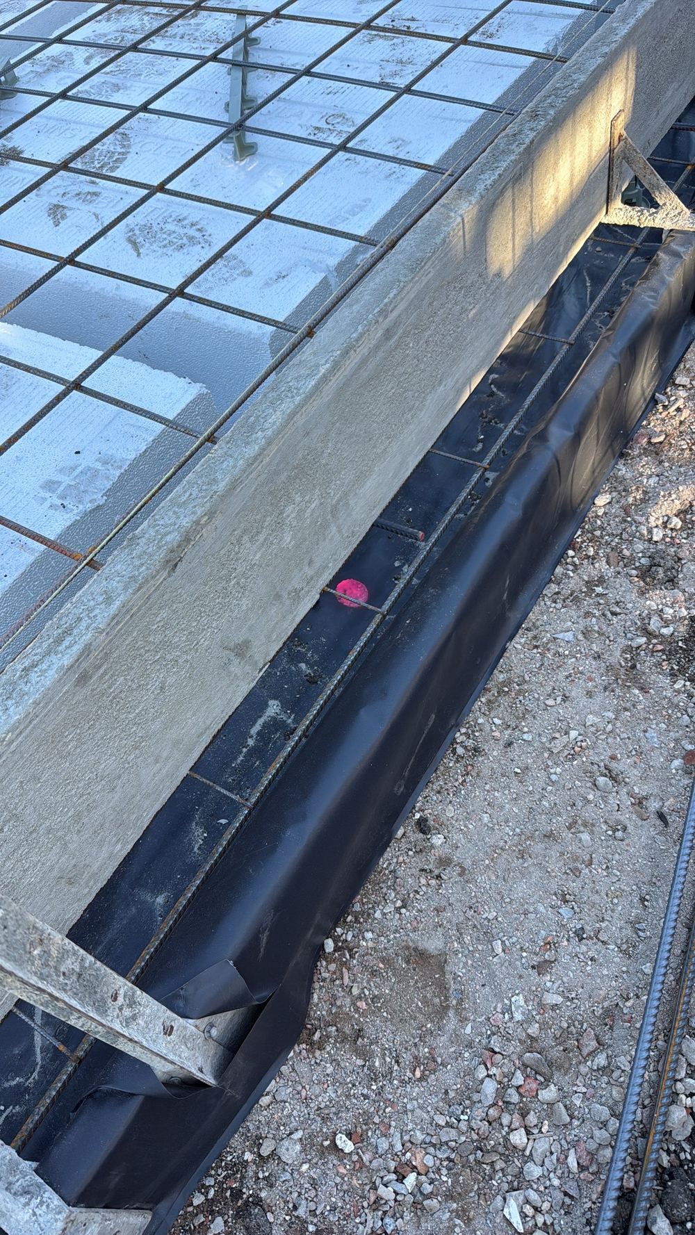 Edge beam steel short of bar chairs, putting concrete cover at risk, found during a slab pre-pour inspection in Cranbourne East