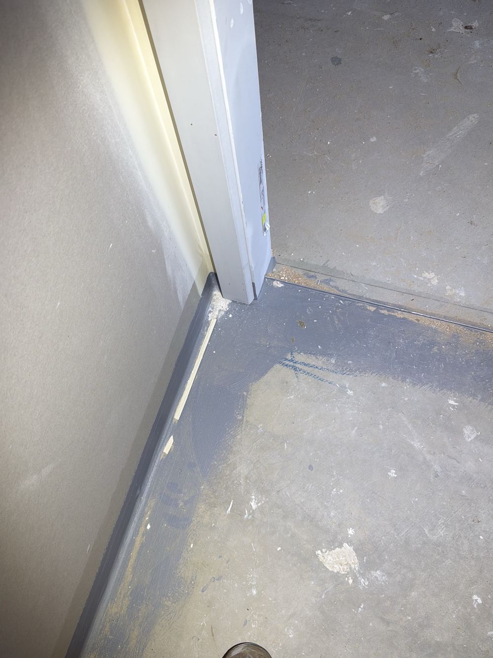 Fresh membrane left uncovered while trades walk across the floor, found during a waterproofing inspection in Pakenham