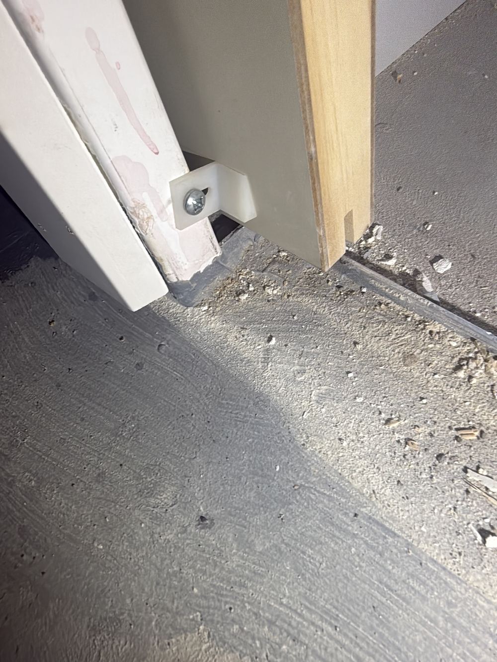 Water stop angle at the door threshold not tied into the wall flashing, found during a waterproofing inspection in Pakenham